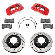 Components laid out for the Wilwood front AERO6-DM brake kit for Toyota Tacoma, SRP drilled and slotted rotors and red powder coat calipers