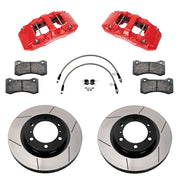 Components laid out for the Wilwood front AERO6-DM brake kit for Toyota Tacoma, GT-slotted rotors and red powder coat calipers