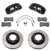 Components laid out for the Wilwood front AERO6-DM brake kit for Toyota Tacoma, GT-slotted rotors and black powder coat calipers
