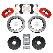 Components laid out for the Wilwood front FNSL6R brake kit for Chevrolet Corvette C7, SRP drilled and slotted rotors and red powder coat calipers