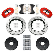 Components laid out for the Wilwood front FNSL6R brake kit for Chevrolet Corvette C7, SRP drilled and slotted rotors and red powder coat calipers