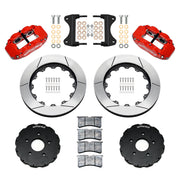 Components laid out for the Wilwood front FNSL6R brake kit for Chevrolet Corvette C7, GT-slotted rotors and red powder coat calipers