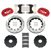 Components laid out for the Wilwood front XRS6R brake kit for Chevrolet Corvette C7, SRP drilled and slotted rotors and red powder coat calipers