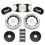 Components laid out for the Wilwood front XRS6R brake kit for Chevrolet Corvette C7, SRP drilled and slotted rotors and black powder coat calipers