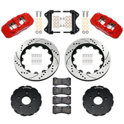 Components laid out for the Wilwood front AERO6 brake kit for Chevrolet Corvette C7, SRP drilled and slotted rotors and red powder coat calipers