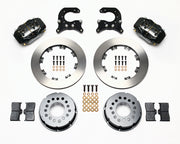 Components laid out for the Wilwood rear Dynalite Pro Series brake kit for Oldsmobile/Pontiac Housing Ends, plain face rotors and black powder coat calipers