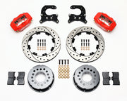 Components laid out for the Wilwood rear Dynalite Pro Series brake kit for Oldsmobile/Pontiac Housing Ends, SRP drilled and slotted rotors and red powder coat calipers