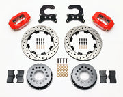 Components laid out for the Wilwood rear Dynalite Pro Series brake kit for Chevrolet 12-Bolt C-Clip Axles, SRP drilled and slotted rotors and red powder coat calipers