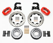 Components laid out for the Wilwood rear Dynalite Pro Series brake kit for Small Ford Housing Ends, 2.66-Inch Offset, SRP drilled and slotted rotors and red powder coat calipers