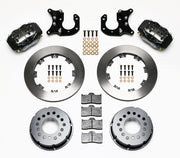 Components laid out for the Wilwood rear Dynalite Pro Series brake kit for Big Ford Housing Ends, 2.36-Inch Offset, plain face rotors and black powder coat calipers