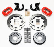 Components laid out for the Wilwood rear Dynalite Pro Series brake kit for Big Ford Housing Ends, 2.36-Inch Offset, SRP drilled and slotted rotors and red powder coat calipers