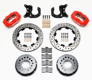 Components laid out for the Wilwood rear Dynalite Pro Series brake kit for New-Style Big Ford Ends, 2.50-Inch Offset, SRP drilled and slotted rotors and red powder coat calipers