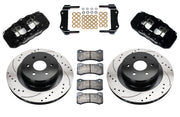 Wilwood black AERO4 rear brake kit with 14.25-inch drilled-and-slotted rotors, components laid out