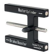 Wilwood black pushrod depth gauge with sliding metal measuring pin, adjusting knob and printed direction arrows