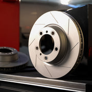 Rennline Right Rear Brake Rotor: Vented, slotted, & GEOMET coated for improved heat dissipation, rust resistance, & performance. Shop now at PMB Performance.