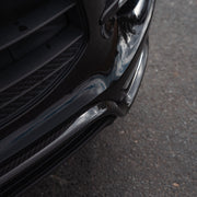 Rennline Carbon Fiber "Mustache" Front Lip for Macan: Hand-laid carbon fiber, high-gloss UV finish, OEM+ fit, & easy installation. Shop now at PMB Performance.