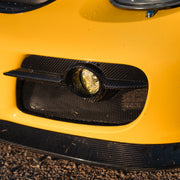 Rennline Carbon Fiber Fog Light Bezels: Upgrade your 987 with hand-laid carbon fiber bezels for a perfect OEM+ fit. Shop now at PMB Performance.