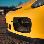 Rennline Carbon Fiber Fog Light Bezels: Upgrade your 987 with hand-laid carbon fiber bezels for a perfect OEM+ fit. Shop now at PMB Performance.