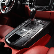 Rennline Carbon Fiber Center Console Surround for Macan: High-quality carbon fiber trim for a sleek, OEM-fit upgrade. Easy install. Shop now at PMB Performance.