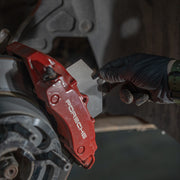 Rennline Titanium Rear Brake Shims: Reduce heat by 10%, prevent brake failure, and improve performance. Set of four, not for PCCB systems. Shop now at PMB.