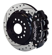 Wilwood rear black Superlite 4R caliper beside a 14.00-inch drilled/slotted rotor, angled assembly for new-style Big Ford 2.50-inch offset