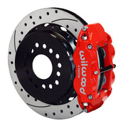 Wilwood rear red Superlite 4R caliper beside a 14.00-inch drilled/slotted rotor, angled assembly for new-style Big Ford 2.50-inch offset
