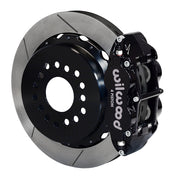 Wilwood rear black Superlite 4R caliper beside a 14.00-inch slotted rotor, angled assembly for new-style Big Ford 2.50-inch offset