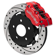 Wilwood front red Narrow Dynapro caliper beside an 11.75-inch drilled/slotted rotor, angled assembly for Mustang Pro-Street disc spindle