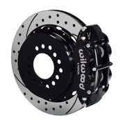 Wilwood rear black Superlite 4R caliper beside a 12.88-inch drilled/slotted rotor, angled assembly for large C10 2.42-inch-offset axle