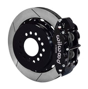 Wilwood rear black Superlite 4R caliper beside a 12.88-inch slotted rotor, angled assembly for large C10 2.42-inch-offset axle