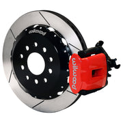 Wilwood rear red CPB caliper beside a 12.88-inch slotted rotor, angled assembly for Mustang solid axle, 3.25-inch offset