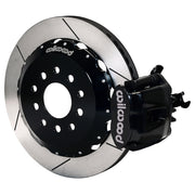 Wilwood rear black CPB caliper beside a 12.88-inch slotted rotor, angled assembly for Mustang solid axle, 3.25-inch offset