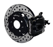 Wilwood rear black CPB caliper beside an 11.00-inch drilled/slotted rotor, angled assembly for Honda/Acura disc hubs, 2.39-inch offset