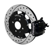Wilwood rear black CPB caliper beside a 12.19-inch drilled/slotted rotor, angled assembly for Honda/Acura original-disc hub arrangement