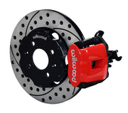 Wilwood rear red CPB caliper beside an 11.00-inch drilled/slotted rotor, angled assembly for Civic 2.46-inch drum hubs