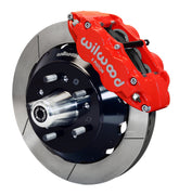 Wilwood front red Superlite 6R caliper beside a 12.88-inch slotted rotor, angled assembly for early Ford/Mercury disc spindles