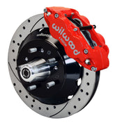 Wilwood front red Superlite 6R caliper beside a 12.88-inch drilled/slotted rotor, angled assembly for Chevrolet CPP passenger-car spindles