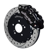 Wilwood front black Superlite 6R caliper beside a 12.88-inch drilled/slotted rotor, angled assembly for S2000 front hub arrangement