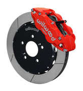 Wilwood front red Superlite 6R caliper beside a 12.88-inch slotted rotor, angled assembly for S2000 front hub arrangement