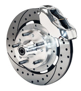 Wilwood front shiny silver Dynalite caliper beside a 12.19-inch drilled/slotted rotor, angled assembly for Mustang II/Pinto original disc spindle