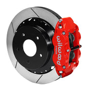 Wilwood rear red Superlite 4R caliper beside a 14.00-inch slotted rotor, angled assembly for Corvette C2/C3 large rear rotor setup