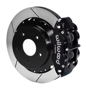 Wilwood rear black Superlite 4R caliper beside a 14.00-inch slotted rotor, angled assembly for Corvette C2/C3 large rear rotor setup