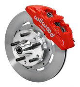 Wilwood front red Dynapro 6 caliper beside a 12.19-inch plain-face rotor, angled assembly for GM/Ford pin-spindle six-piston setup