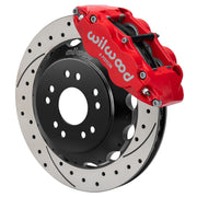 Wilwood front red Superlite 6R caliper beside a 13.06-inch drilled/slotted rotor, angled assembly for Corvette C2/C3 front hub setup