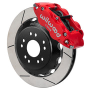 Wilwood front red Superlite 6R caliper beside a 13.06-inch slotted rotor, angled assembly for Corvette C2/C3 front hub setup