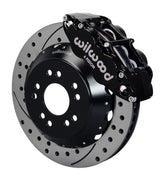 Wilwood front black Superlite 6R caliper beside a 14.00-inch drilled/slotted rotor, angled assembly for Corvette C2/C3 front big-brake layout