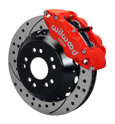 Wilwood front red Superlite 6R caliper beside a 14.00-inch drilled/slotted rotor, angled assembly for Corvette C2/C3 front big-brake layout