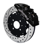 Wilwood front black Dynapro 6 caliper beside a 12.19-inch drilled/slotted rotor, angled assembly for Honda/Acura 262 mm factory spindle
