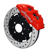 Wilwood front red Dynapro 6 caliper beside a 12.19-inch drilled/slotted rotor, angled assembly for Honda 240 mm factory spindle