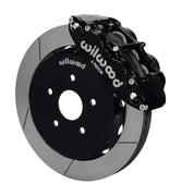 Wilwood front black Superlite 6R caliper beside a 12.88-inch slotted rotor, angled assembly for Matrix FWD 2.4L front hub